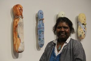 Alison Murray with two of the 10 bagu she completed for the 2016 National Indigenous Ceramic Art Awards.  Photo Girringun Aboriginal Art Centre