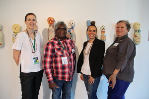 Abe Muriata and Valerie Keenan of Girringun welcome visitors from the Shepparton Art Callery to CIAF.  Rebecca Coates and Belinda Briggs travelled to Cairns and saw artworks by Alison Murray at the Girringun stand.  Photo R Morten Girringun Aboriginal Art Centre
